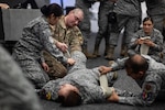 U.S. Army Staff Sgt. Hunter Vaught, combat medic program manager for the South Carolina Army National Guard, and Colombia Aerospace Force medical personnel practice a Level 2 Tactical Combat Casualty Care procedure during Relámpago de los Andes, a multinational exercise held at Palanquero Air Base, Colombia, Aug 2, 2025. Led by Colombia, RDLA is a combined exercise that reinforces the enduring partnership between the United States and Colombia while enhancing joint interoperability across forces.