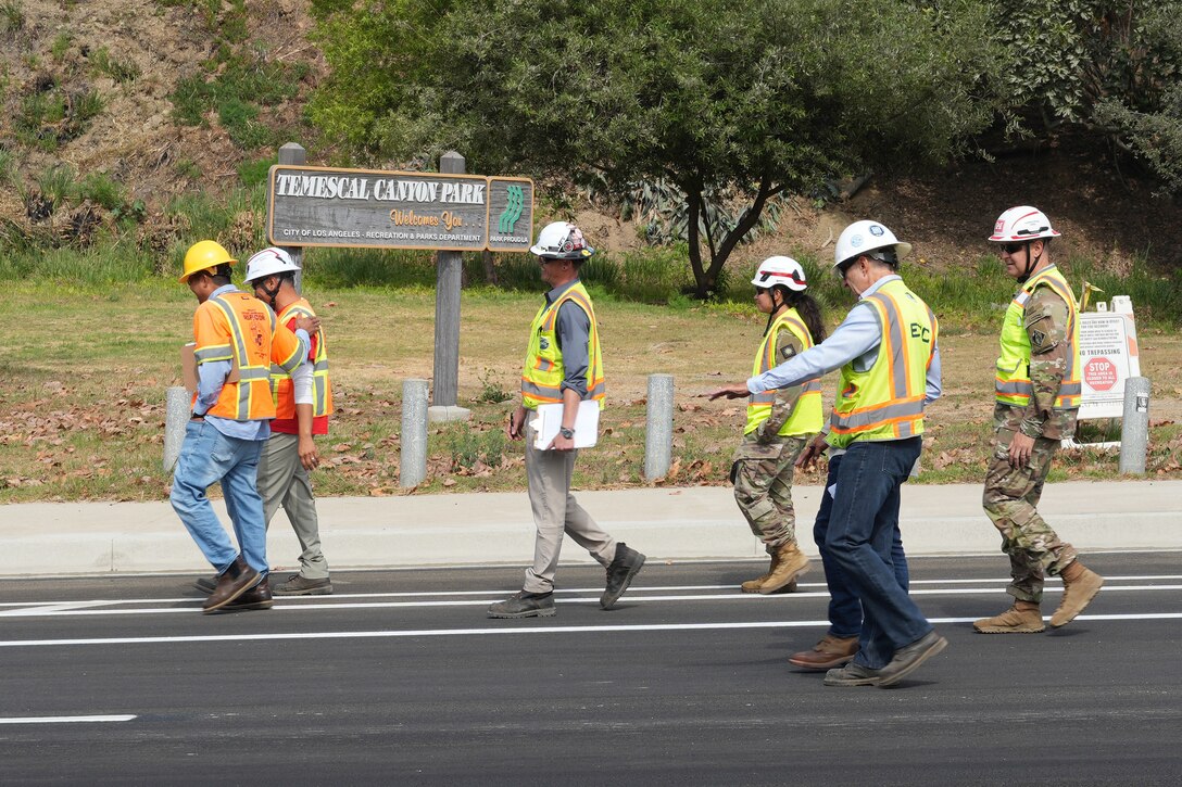 Col. Jeff Palazinni, commander of the U.S. Army Corps of Engineers wildfire debris mission's Palisades Emergency Field Office, along with USACE contractors and officials from the City of Los Angeles conducted a final walk-through inspection of Temescal Canyon Road Aug. 4 to ensure it’s ready to receive traffic.