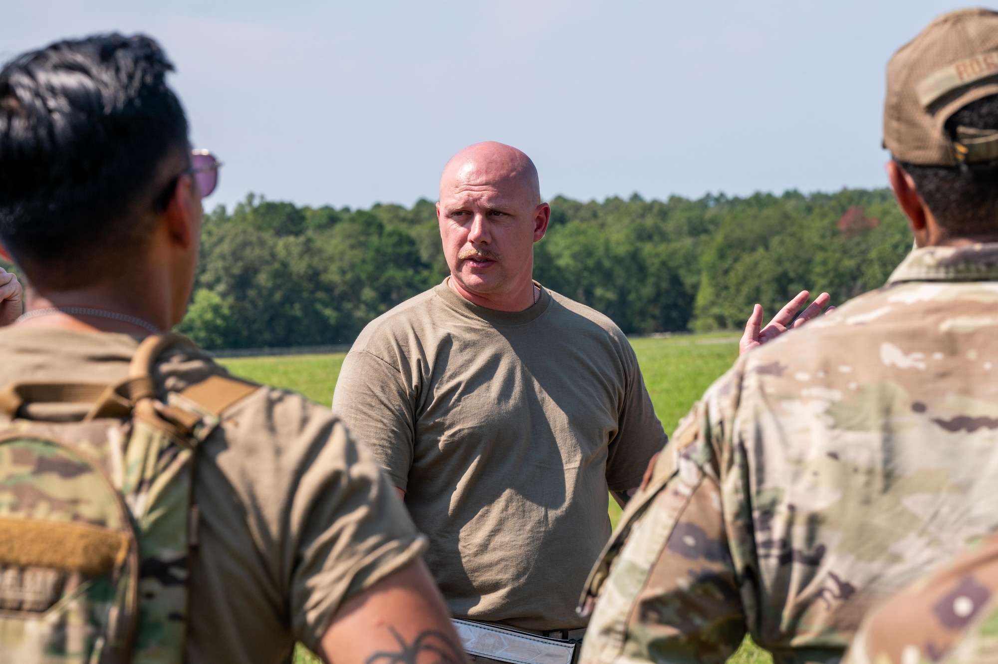 U.S. Air Force Master Sgt. Kevin Bolton, 21st Air Task Force air transportation superintendent, briefs Airmen on landing zone operations during exercise Bamboo Eagle 25-3 at Camp Robinson, Arkansas, August 4, 2025. The training exercise supports the 21st ATF’s commitment to executing rapid force flow in contested environments. BE 25-3 empowered Airmen to demonstrate their professionalism and innovation, developing solutions to complex challenges in real-time. (U.S. Air Force photo by Airman 1st Class Adrien Tran)