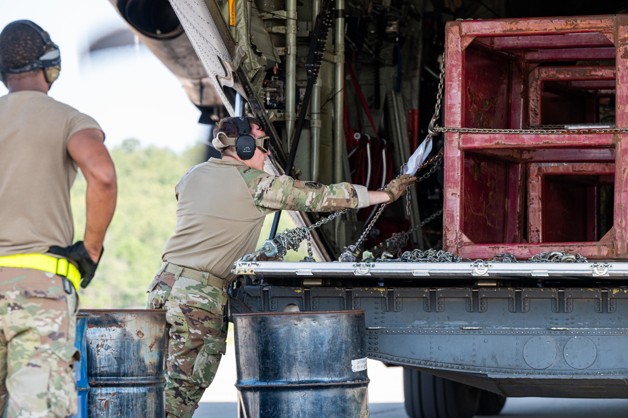 U.S. Air Force Tech. Sgt. Tylor Borggren, 21st Combat Air Base Squadron air logistics liaison, secures cargo harnesses on a C-130J Super Hercules during exercise Bamboo Eagle 25-3 at Camp Robinson, Arkansas, August 4, 2025. BE 25-3 tested 21st CABS’s ability to adapt and innovate under dynamic operational environments. (U.S. Air Force photo by Airman 1st Class Adrien Tran)