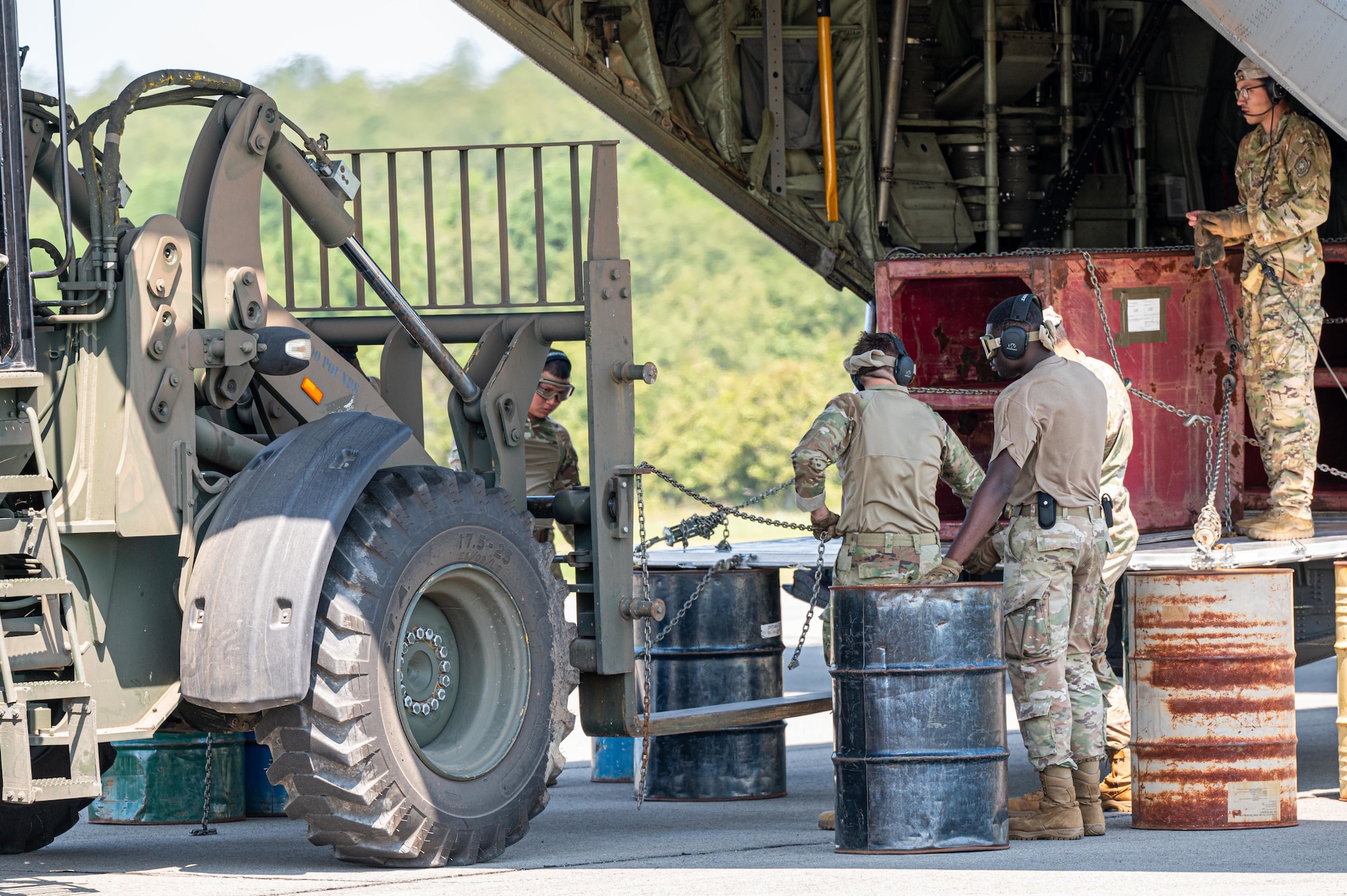U.S. Air Force Airmen assigned to the 21st Combat Air Base Squadron prepare a forklift to move cargo during exercise Bamboo Eagle 25-3 at Camp Robinson, Arkansas, August 4, 2025. BE 25-3 tested the 21st CABS’ ability to establish a functioning landing zone in austere environments. (U.S. Air Force photo by Airman 1st Class Adrien Tran)