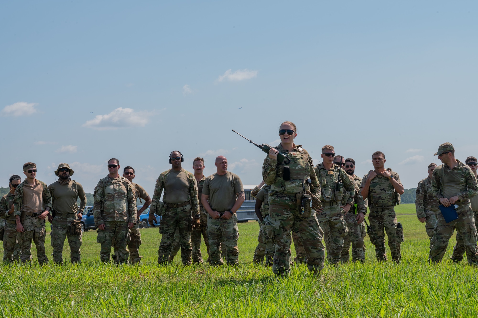 U.S. Air Force Airman, assigned to the 21st Air Task Force, awaits status updates on an incoming C-130J Super Hercules from the 19th Airlift Wing during exercise Bamboo Eagle 25-3 at Camp Robinson, Arkansas, August 4, 2025. BE 25-3 tested the 21st CABS’ ability to rapidly support aircraft arrival in austere conditions. (U.S. Air Force photo by Senior Airman Alondra Cristobal Hernandez)