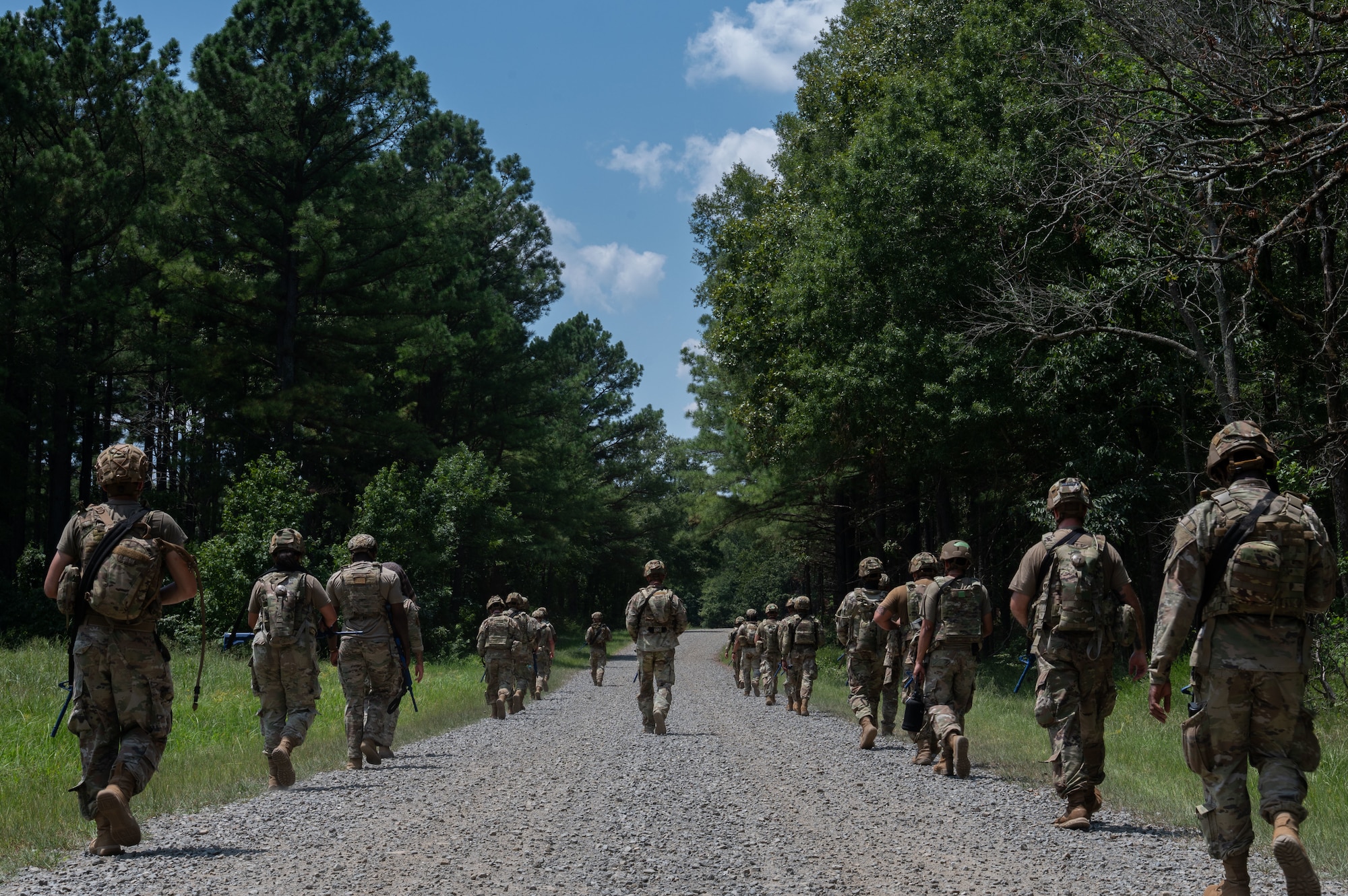 Airmen assigned to the 21st Combat Air Base Squadron travel from a forward operating site to a contingency location during exercise Bamboo Eagle 25-3 at Camp Robinson, Arkansas, Aug. 5, 2025. During BE 25-3, Airmen were provided opportunities to practice Agile Combat Employment by rapidly establishing forward operating sites, demonstrating how forces can be dispersed, mobilized and sustained across a broad operational theater. (U.S. Air Force photo by Senior Airman Alondra Cristobal)