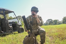 U.S. Air Force Senior Airman Isaiah Chavez, 52nd Combat Communication Squadron radio frequency transmissions systems journeyman, communicates with the main operating base station from a forward operating site during exercise Bamboo Eagle 25-3 at Camp Robinson, Arkansas, August 2, 2025. BE 25-3 provides the 21st Air Task Force with opportunities to refine their expeditionary skills, ensuring they are ready to lead and succeed in the most demanding environments. (U.S. Air Force photo by Airman 1st Class Adrien Tran)