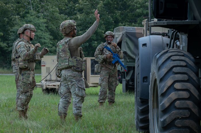 U.S. Air Force Airmen assigned to the 21st Combat Air Base Squadron gather materials to establish a forward operating site during exercise Bamboo Eagle 25-3 at Camp Robinson, Arkansas, August 2, 2025. During BE 25-3, the 21st Air Task Force is building Mission-Ready Airmen by sharpening tactical skills with the same team they will deploy with when they enter the “available to commit” phase of the new Air Force Force Generation deployment model. (U.S. Air Force photo by Senior Airman Alondra Cristobal Hernandez)