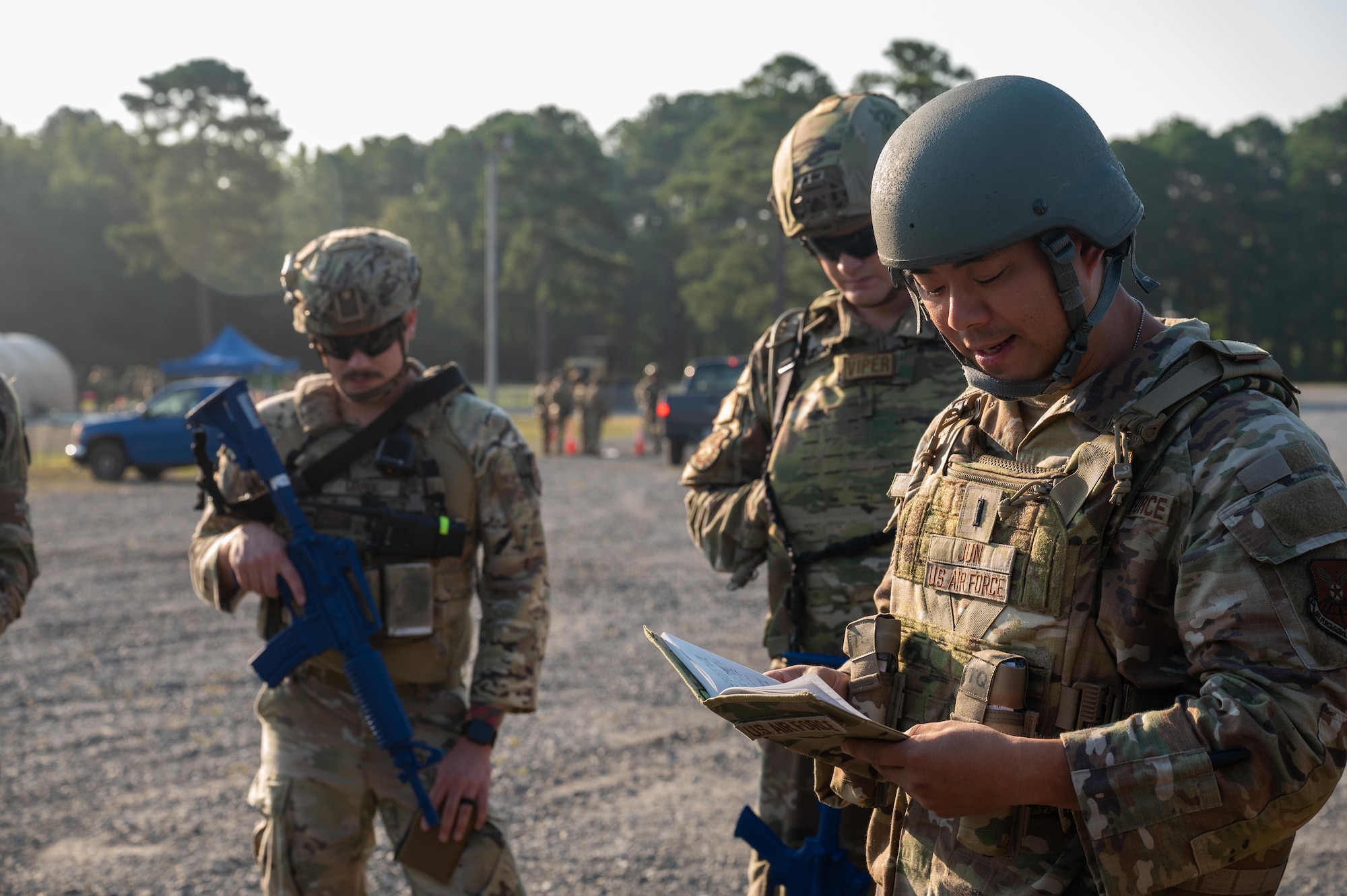 U.S. Air Force 1st Lt. Joseph Jun, 21st Air Task Force chaplain, leads Airmen in prayer during exercise Bamboo Eagle 25-3 at Camp Robinson, Arkansas, August 3, 2025. The chaplain provides spiritual and moral support to help 21st ATF and 21st Combat Air Base Squadron Airmen stay resilient during BE 25-3. (U.S. Air Force photo by Airman 1st Class Adrien Tran)