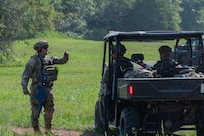 U.S. Air Force Airmen assigned to the 21st Combat Air Base Squadron set up a perimeter around a forward operating site during exercise Bamboo Eagle 25-3 at Camp Robinson, Arkansas, August 2, 2025. During BE 25-3, Airmen were provided opportunities to practice Agile Combat Employment by rapidly establishing forward operating sites, demonstrating how forces can be dispersed, mobilized and sustained across a broad operational theater. (U.S. Air Force photo by Senior Airman Alondra Cristobal Hernandez)