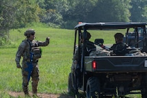 U.S. Air Force Airmen assigned to the 21st Combat Air Base Squadron set up a perimeter around a forward operating site during exercise Bamboo Eagle 25-3 at Camp Robinson, Arkansas, August 2, 2025. During BE 25-3, Airmen were provided opportunities to practice Agile Combat Employment by rapidly establishing forward operating sites, demonstrating how forces can be dispersed, mobilized and sustained across a broad operational theater. (U.S. Air Force photo by Senior Airman Alondra Cristobal Hernandez)