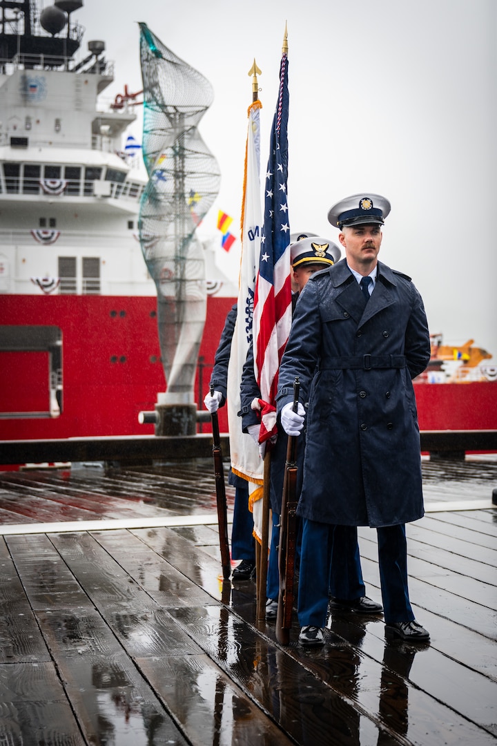 U.S. Coast Guard Petty Officer First Class Chase McNatt, a yeoman assigned to Arctic District, conducts the presentation of the colors during the U.S. Coast Guard Cutter Storis (WAGB 21) commissioning ceremony at Juneau, Alaska, August 10, 2025. Storis is the first polar icebreaker acquired in more than 25 years by the Coast Guard with its mission to assure access to the polar regions and protect U.S. sovereignty. (U.S. Coast Guard photo by Petty Officer 2nd Class Alexander Ransom)