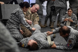 U.S. Army Staff Sgt. Hunter Vaught, combat medic program manager for the South Carolina Army National Guard, and Colombia Aerospace Force medical personnel practice a Level 2 Tactical Combat Casualty Care procedure during Relámpago de los Andes, a multinational exercise held at Palanquero Air Base, Colombia, Aug 2, 2025.