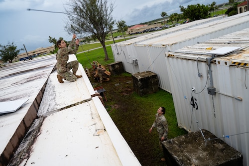 U.S. Air Force Airman 1st Class Hannah Abudayeh, left, and 1st Lt. Felicity Taylor, 19th Operations Support Squadron all source intelligence analysts, install a satellite communication device at Andersen Air Force Base, Guam, during the Air Force’s 2025 Department-Level Exercise series, July 26, 2025. The DLE is a new way of conducting operations in a contested, dynamic environment to build capabilities making a stronger, deterrent force. The DLE series encompasses all branches of the Department of Defense, along with Allies and partners, employing more than 400 Joint and coalition aircraft and more than 12,000 members at more than 50 locations across 3,000 miles. (U.S. Air Force photo by Senior Airman Jade M. Caldwell)