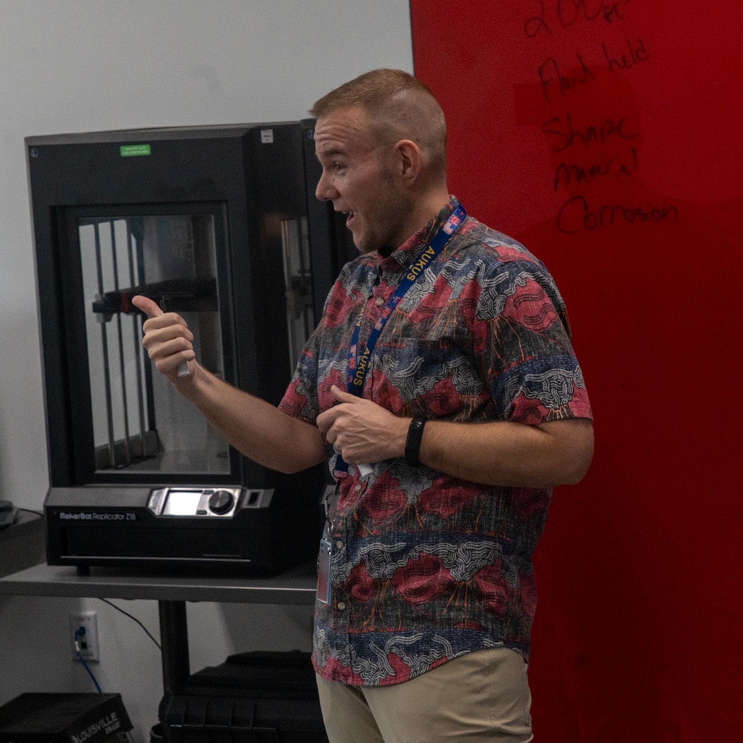Matt Cook, a nuclear engineer at Pearl Harbor Naval Shipyard and Maintenance Facility, shares insights into engineering design and nuclear fundamentals with interns from the Junior Engineers Summer STEM Experience (JESSE) program during a problem-solving workshop in the iLab, June 12, 2025
