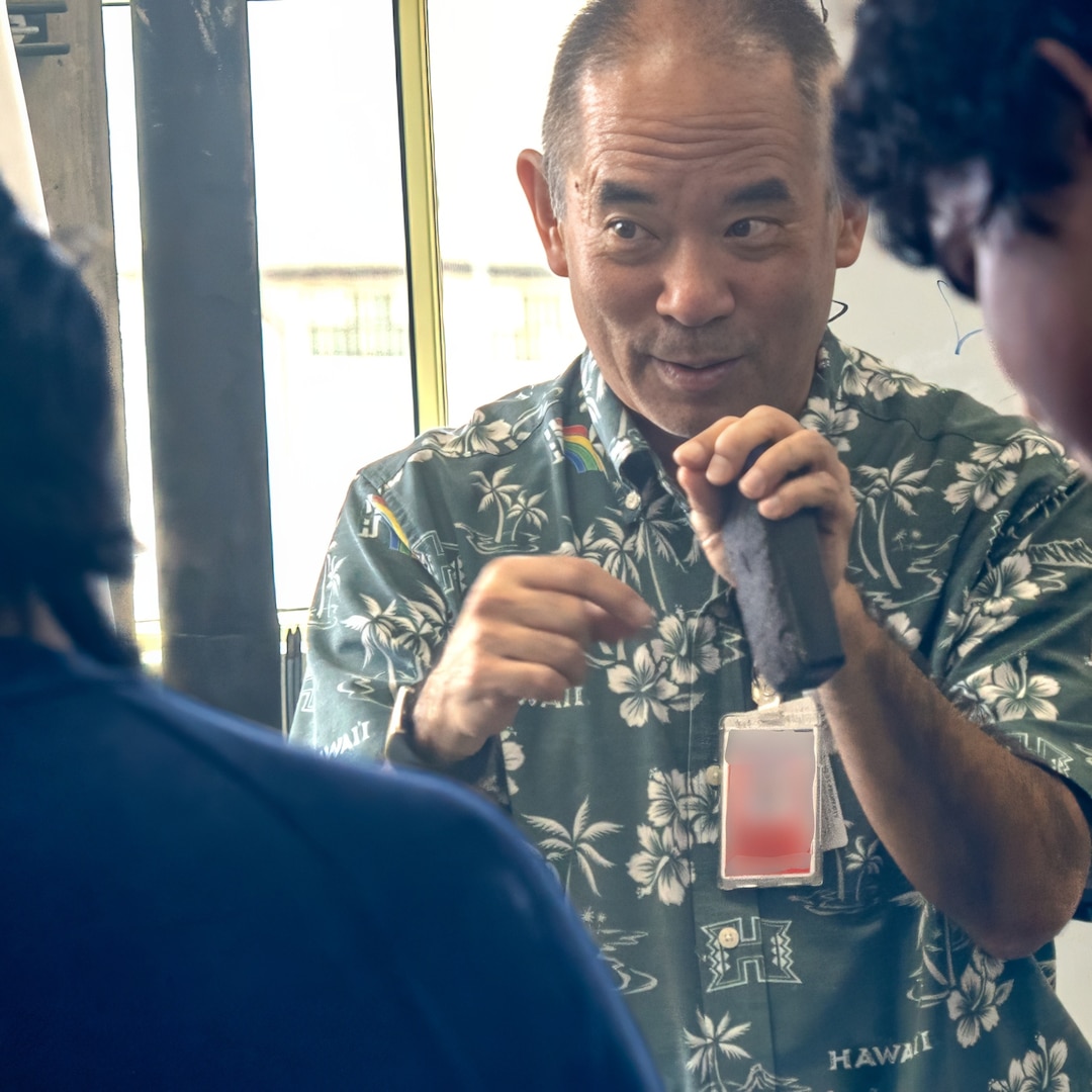 Sy Shimabukuro, an engineer at Pearl Harbor Naval Shipyard and Maintenance Facility explains troubleshooting principles to interns from the Junior Engineers Summer STEM Experience (JESSE) program during a hands-on workshop in the iLab, June 12, 2025.