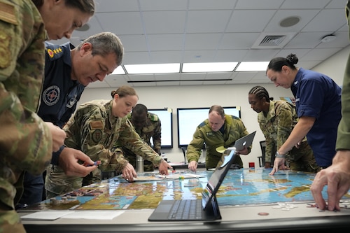 Students from Air War College participate in a war-game designed around Pacific conflict, December 21, 2023. The U.S. Space Force will host the Schriever Wargame Capstone 2025 Aug. 10-21, a tabletop wargame set a decade in the future, where players will respond to a notional conflict scenario, test the limits of strategies and policies and consider how advanced technologies could strengthen coalition operations. This year’s iteration will bring together more than 350 participants from the United States Department of Defense, industry and partner nations. (U.S. Air Force photo by Billy Blankenship)