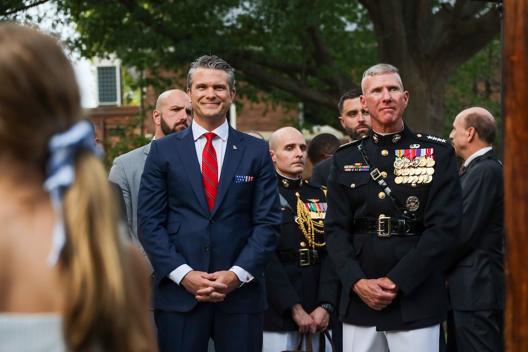 The Guest of Honor for the evening, Secretary of Defense Pete Hegseth stands left of the parade's Hosting Official, Gen. Eric M. Smith, 39th Commandant of the Marine Corps, during the Garden Party Reception prior to the start of the Evening Parade at Marine Barracks Washington, D.C., July 18, 2025. Evening Parades are held every Friday during the summer at Marine Barracks Washington and features the United States Marine Corps Silent Drill Platoon, “The President’s Own” United States Marine Band, “The Commandant’s Own” United States Marine Drum & Bugle Corps, and the official United States Marine Corps Color Guard, demonstrating the precision and discipline of the Marine Corps. (U.S. Marine Corps photo by Cpl. Christopher Prelle)