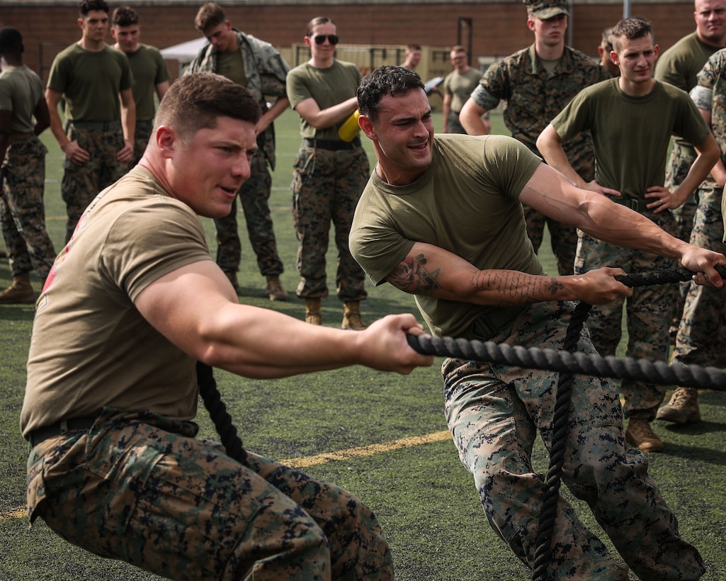 U.S. Marine Corps Sgt. Erik Benzeleski, left, and Lance Cpl. Angelo Monsini, with Headquarters & Service Company, Marine Barracks Washington, conduct the truck pull during the Non-commissioned Officer Field Meet hosted by the NCO Guild at Marine Barracks Washington, D.C., July 23, 2025. The event challenged Marines from across the battalion with a series of physically demanding competitions designed to build teamwork, morale, and unit pride. Headquarters & Service Company showcased determination and grit as they pushed through each event alongside their fellow Marines. (U.S. Marine Corps photo by Lance Cpl. Brynn Bouchard)