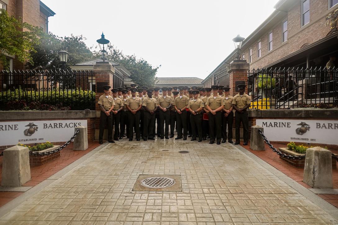U.S. Marines with Marine Barracks Washington pose for a photo following the graduation of MBW Corporal's Course Class 1-25 at Marine Barracks Washington, D.C., July 31, 2025. The course equips Marines with leadership skills and prepares them for increased responsibilities. Family, friends, and fellow Marines attended the ceremony to celebrate the graduates’ accomplishments. (U.S. Marine Corps photo by Cpl. Christopher Prelle)