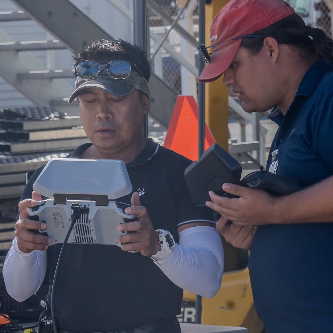 Naval Information Warfare Center technicians operate a drone during a demonstration at Pearl Harbor Naval Shipyard & Intermediate Maintenance Facility, Hawaii, June 18, 2025.