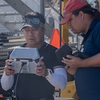 Naval Information Warfare Center technicians operate a drone during a demonstration at Pearl Harbor Naval Shipyard & Intermediate Maintenance Facility, Hawaii, June 18, 2025.