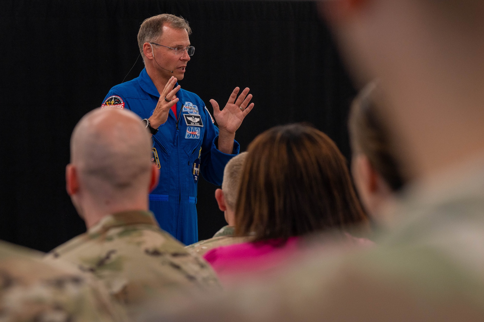 astronaut speaks to audience