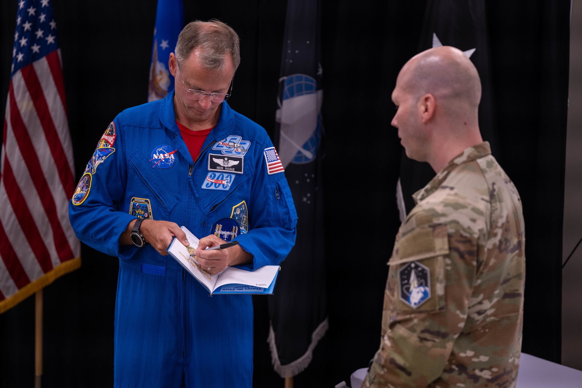 astronaut gives autograph
