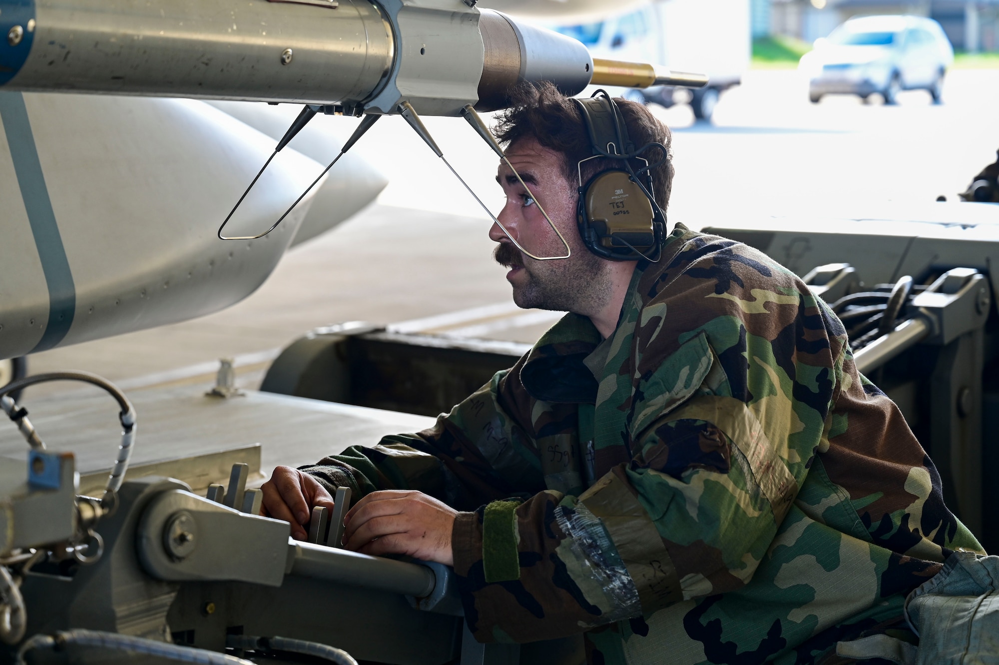 A man uses controls on a platform.