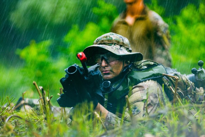 A Soldier from Brutal Company takes a defensive position during a blank-fire squad attack at Rodriguez Live Fire Complex, South Korea on Aug. 6, 2025.