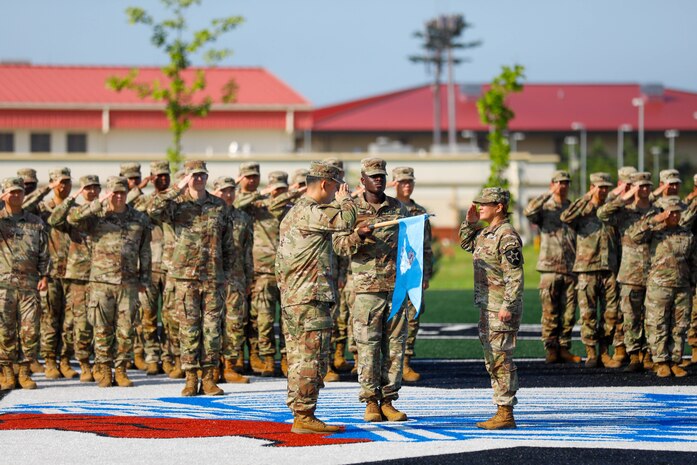 U.S. Army soldiers assigned to the 528th Military Intelligence Company, 2nd Infantry Division/ROK-U.S. Combined Division, uncase the unit guidon during the unit's activation ceremony August 5, 2025, on Camp Humphreys, South Korea.