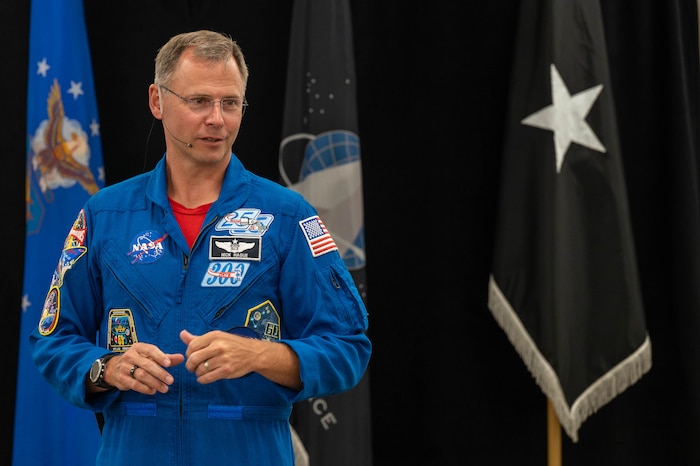 astronaut speaking to audience