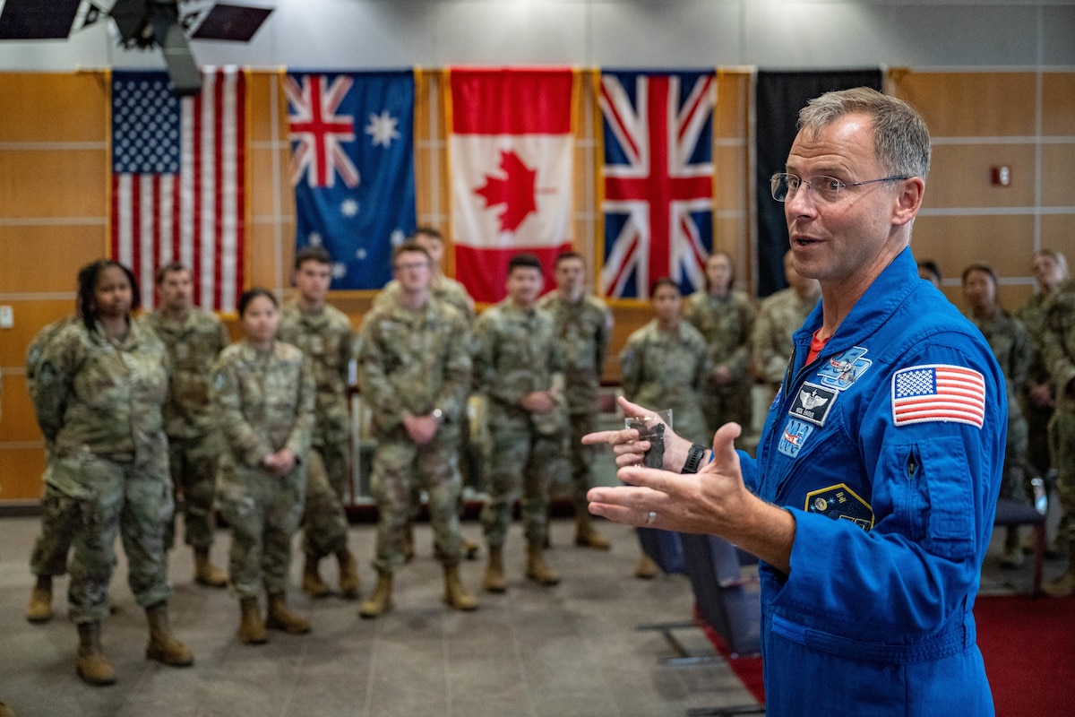 astronaut speaks to military members