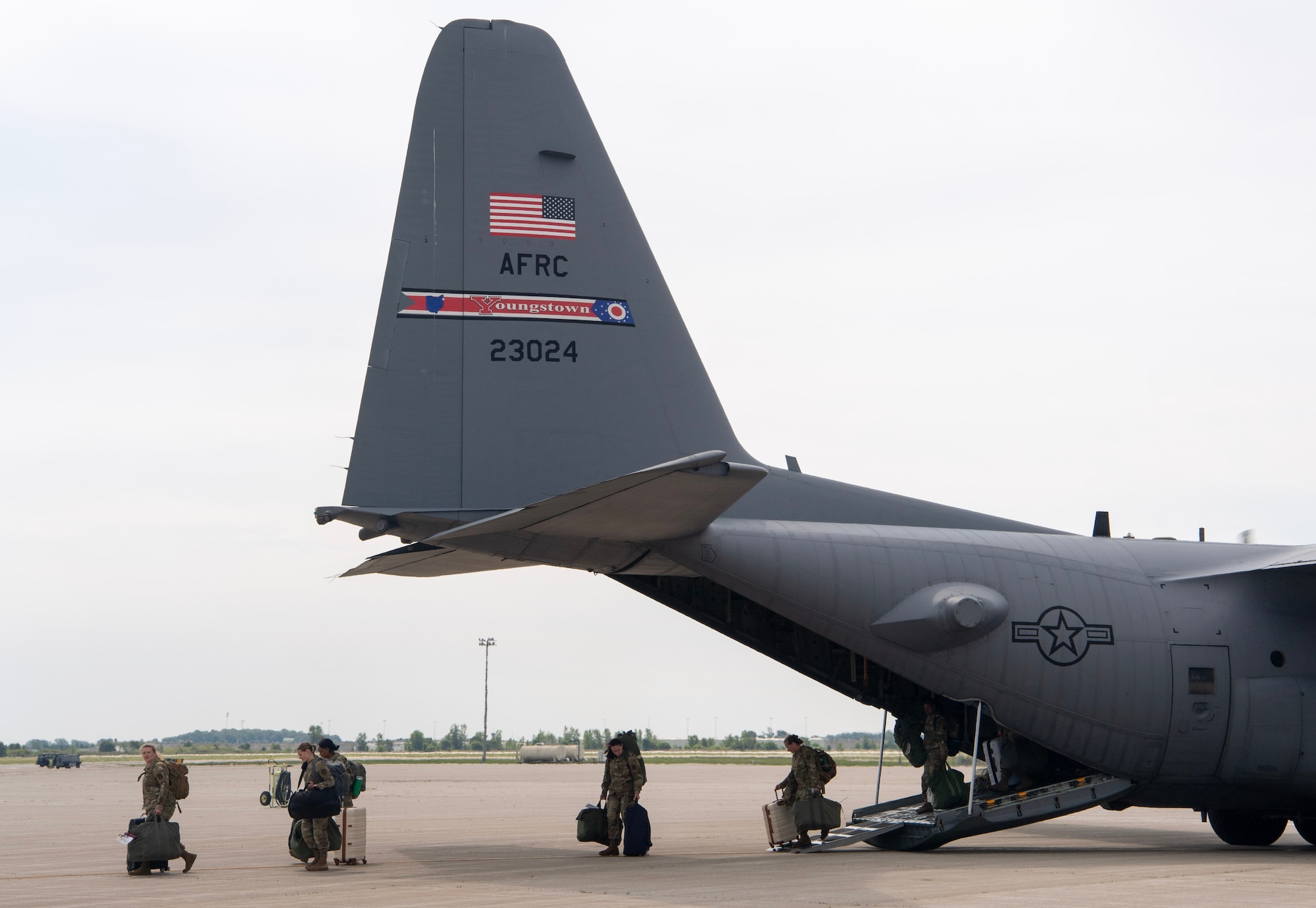 U.S. Reserve Airmen from the 910th Airlift Wing at Youngstown Air Reserve Station, Ohio, exit a C-130 Super Hercules upon arrival at Grissom Air Reserve Base, Ind., Aug. 2, 2025, kicking off Exercise Patriot Medic 25. The exercise focuses on trauma care, patient evacuation, en route care, and joint interoperability to ensure forces are combat-ready and mission-capable. (U.S. Air Force photo/Benjamin Mota)