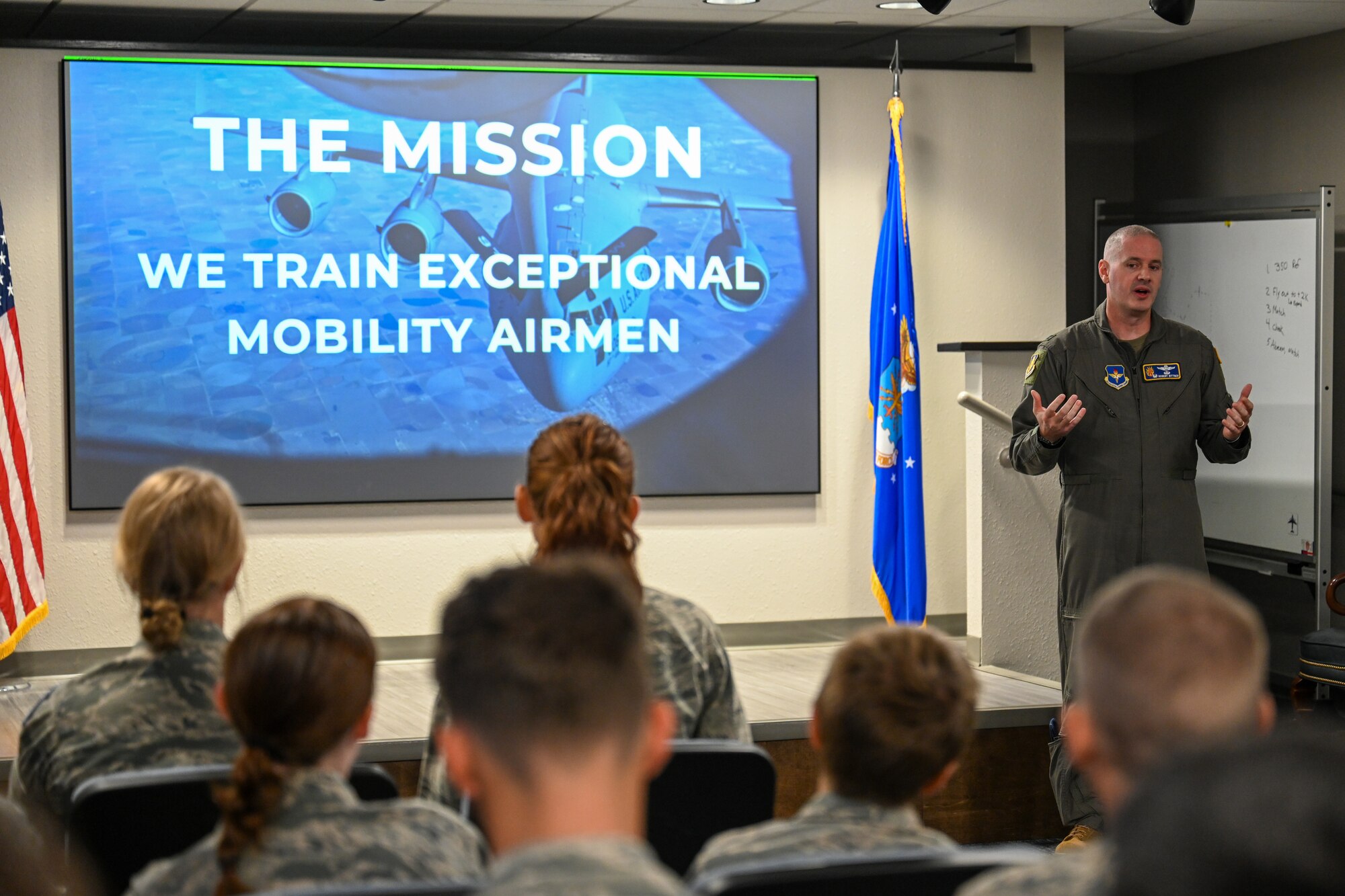 U.S. Air Force Col. Robert Bittner Jr., 97th Operations Group commander, briefs Civil Air Patrol cadets on the mission of the 97th Air Mobility Wing (AMW) at Altus Air Force Base, Oklahoma, Aug. 6, 2025. Bittner answered questions from the cadets about the Air Force, providing insight into the operational side of the 97th AMW. (U.S. Air Force photo by Airman 1st Class Nathan Langston)