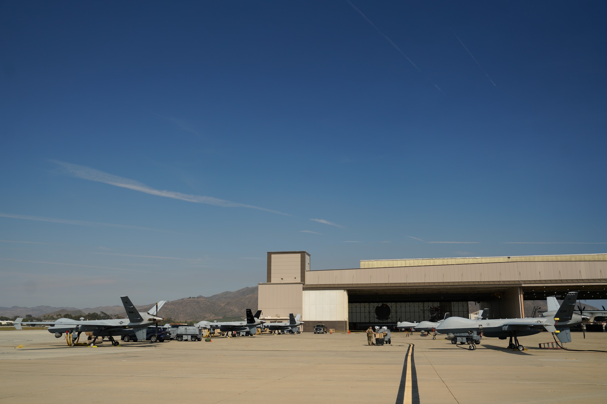 Six U.S. Air Force MQ-9 Reaper remotely piloted aircraft undergo routine maintenance