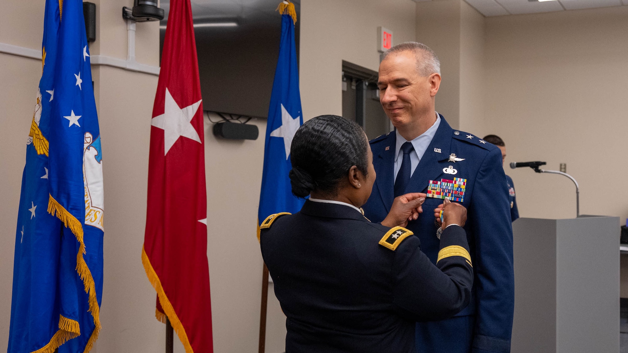 Maryland Army National Guard Maj. Gen. Janeen Birckhead, adjutant general for Maryland, awards Maj. Gen. Matthew D. Dinmore,  the National Guard assistant to the commander, U.S. Cyber Command, and director, National Security Agency and Central Security Service, with the Defense Superior Service Medal during his retirement ceremony at Warfield Air National Guard Base at Martin State Airport, August 10, 2025. The medal recognizes superior meritorious service in a position of significant responsibility. (U.S. Air National Guard photo by Airman 1st Class Sarah Hoover)