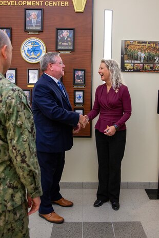Mr. Michael Durkin, Director of the Navy Warfare Development Center (NWDC), speaks with U.S. Senator Tim Kaine (VA) during his visit to NWDC in Norfolk, Va., on Aug. 4, 2025. Senator Kaine, a member of the Senate Armed Services Committee, received an overview of the Navy’s evolving warfighting concepts and preparations for Large Scale Exercise (LSE) 2025, which will test the Fleet’s ability to conduct integrated, distributed maritime operations across multiple theaters.