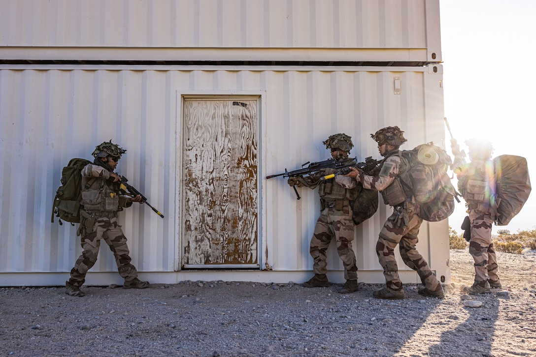 French soldiers with 2nd Foreign Infantry Regiment, 6th Light Armored Brigade Command, conduct Close Quarter Training on range 225 as part of Service Level Training Exercise 4-25, on Marine Corps Air-Ground Combat Center, Twentynine Palms, California, Aug. 6, 2025. SLTE 4-25 is designed to be a challenging, realistic training environment that produces combat-ready forces capable of operating as an integrated Marine Air Ground Task Force across all domains of military operations. (U.S. Marine Corps photo by Lance Cpl. Judith Ann Lazaro)