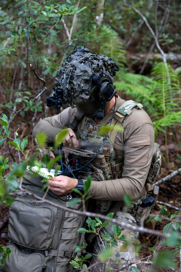 A Dutch Marine with 25 RSTA Squadron, utilizes an Android Tactical Assault Kit during exercise Burmese Chase 25 at Marine Corps Base Camp Lejeune, North Carolina, Aug. 7, 2025. Burmese Chase is an annual U.S. led, multi-lateral training exercise comprised of integrating ground and air fires, infantry tactics and naval gunfire alongside NATO allies to enhance combat readiness and interoperability. (U.S. Marine Corps photo by Cpl. Marc Imprevert) (This photo has been altered for security purposes by blurring out faces.)