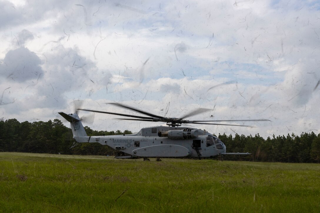 A U.S. Marine Corps CH-53E Super Stallion with Marine Heavy Helicopter Squadron 461, Marine Aircraft Group 29, 2nd Marine Aircraft Wing, lands during a casualty evacuation drill as part of exercise Burmese Chase 25 at Marine Corps Base Camp Lejeune, North Carolina, Aug. 7, 2025. Burmese Chase is an annual U.S. led, multi-lateral training exercise comprised of integrating ground and air fires, infantry tactics and naval gunfire alongside NATO allies to enhance combat readiness and interoperability. (U.S. Marine Corps photo by Cpl. Marc Imprevert)