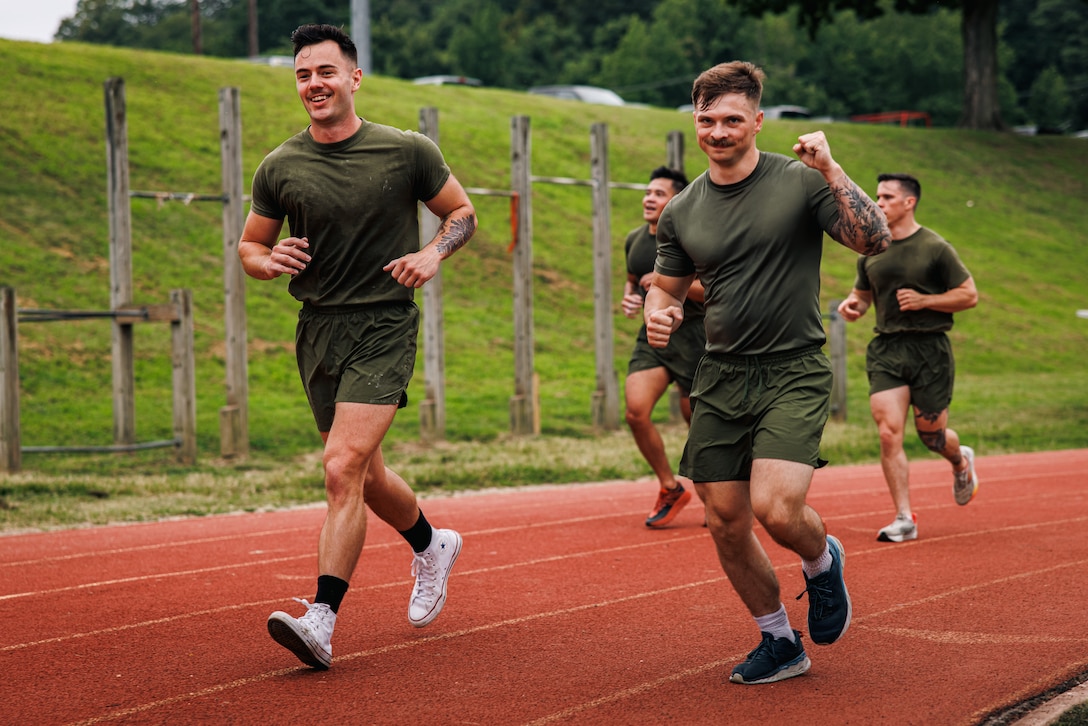 U.S. Marine Corps students with the National Capital Regions Staff Sergeant Transition Symposium conduct sprint/jog drills during a physical training event at Butler Stadium on Marine Corps Base Quantico, Virginia, Aug. 6, 2025. The Fiscal Year 25 NCR Staff Sergeant Transition Symposium is a five-day dynamic professional military education course comprised of FY25 Staff Sergeant selectees from diverse Military Occupational Specialty backgrounds and commands, aiming to shape Marines into ethical, operationally grounded SNCOs. (U.S. Marine Corps photo by Lance Cpl. Braydon Rogers)