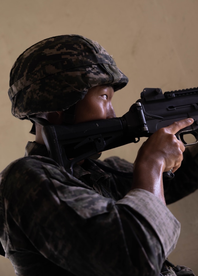 A Republic of Korea Marine with 1st Marine Division, ROK Marine Corps, maintains security during the Korean Marine Exercise Program 25.2, Pohang, South Korea, Aug. 8, 2025. KMEP is conducted regularly between the ROK and U.S. Marine Corps to increase their combined capabilities through realistic training geared towards deterrence and maintaining peace in the Indo-Pacific.  (U.S. Marine Corps photo by Cpl. Kanoa Thomas