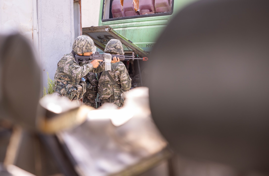 Republic of Korea Marines with 1st Marine Division, ROK Marine Corps, advance through a training area during the Korean Marine Exercise Program 25.2, Pohang, South Korea, Aug. 8, 2025. KMEP is conducted regularly between the ROK and U.S. Marine Corps to increase their combined capabilities through realistic training geared towards deterrence and maintaining peace in the Indo-Pacific.  (U.S. Marine Corps photo by Cpl. Kanoa Thomas)