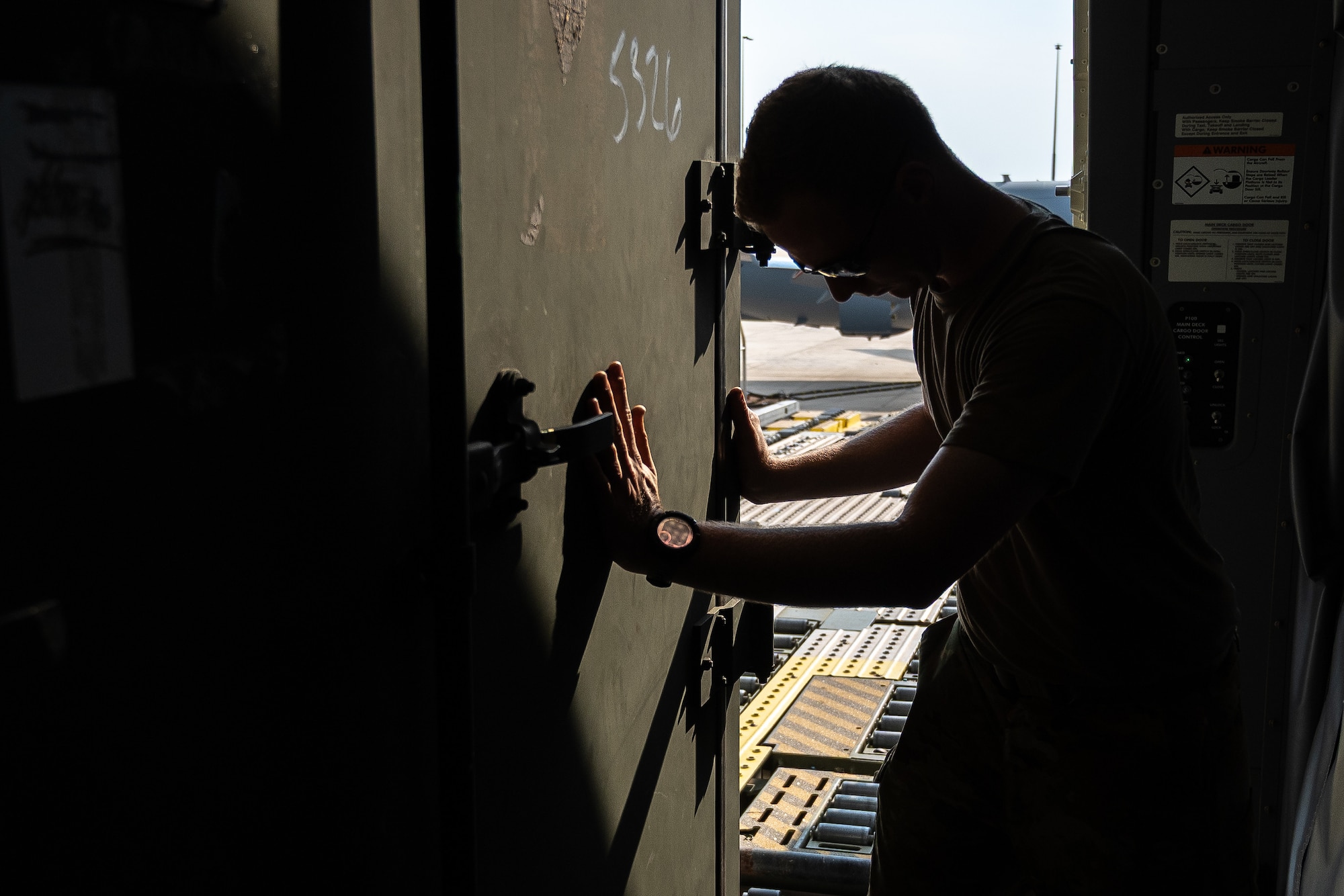 U.S. Air Force Tech. Sgt. David Simpler, boom operator with the 2nd Air Refueling Squadron, moves equipment off a K-Loader onto a KC-46 Pegasus aircraft during Talisman Sabre 25 in Northern Territory, Australia, July 25, 2025. Talisman Sabre is the largest bilateral military exercise between Australia and the United States, advancing a safe and secure Indo-Pacific by strengthening relationships and interoperability among key Allies and partners, while enhancing collective capabilities to respond to a wide array of potential security concerns. (U.S. Air Force photo by Tech. Sgt. Philip Bryant)