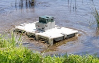 DAHLGREN, Va. – An unmanned surface vessel, designed and built by Science and Engineering Apprenticeship Program interns, operates during a demonstration at Hideaway Pond. The project challenged students to create a low-cost system using commercial off-the-shelf components. (Morgan Lee Tabor/NSWCDD Photo)