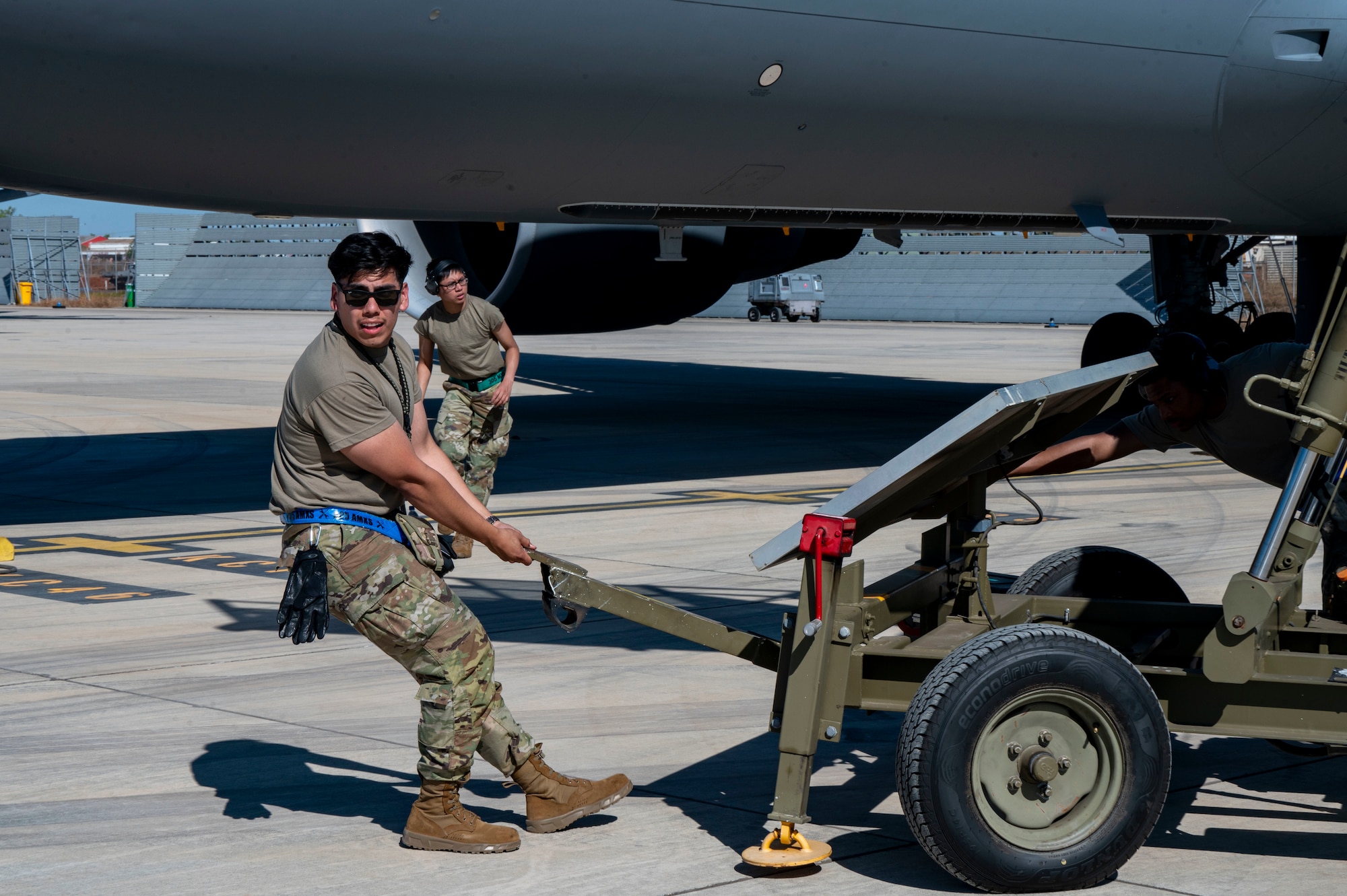 U.S. Air Force Staff Sgt. Brian Izaguirre, a crew chief with the 305th Aircraft Maintenance Squadron, Joint Base McGuire-Dix-Lakehurst, New Jersey, moves maintenance stairs during Talisman Sabre 25 in Northern Territory, Australia, July 14, 2025. This training ensures that Air Mobility Command can respond rapidly and effectively to common challenges in dynamic situations. Talisman Sabre is the largest bilateral military exercise between Australia and the United States, that advances a safe and secure Indo-Pacific by strengthening relationships and interoperability among key allies and partners, while enhancing collective capabilities to respond to a wide array of potential security concerns. (U.S. Air Force photo by Senior Airman Clare Werner)
