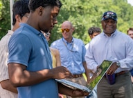 DAHLGREN, Va. – A Science and Engineering Apprenticeship Program intern operates a laptop to run and monitor an unmanned surface vessel during the program’s final demonstration at Naval Surface Warfare Center Dahlgren Division (NSWCDD). (Morgan Lee Tabor/NSWCDD Photo)