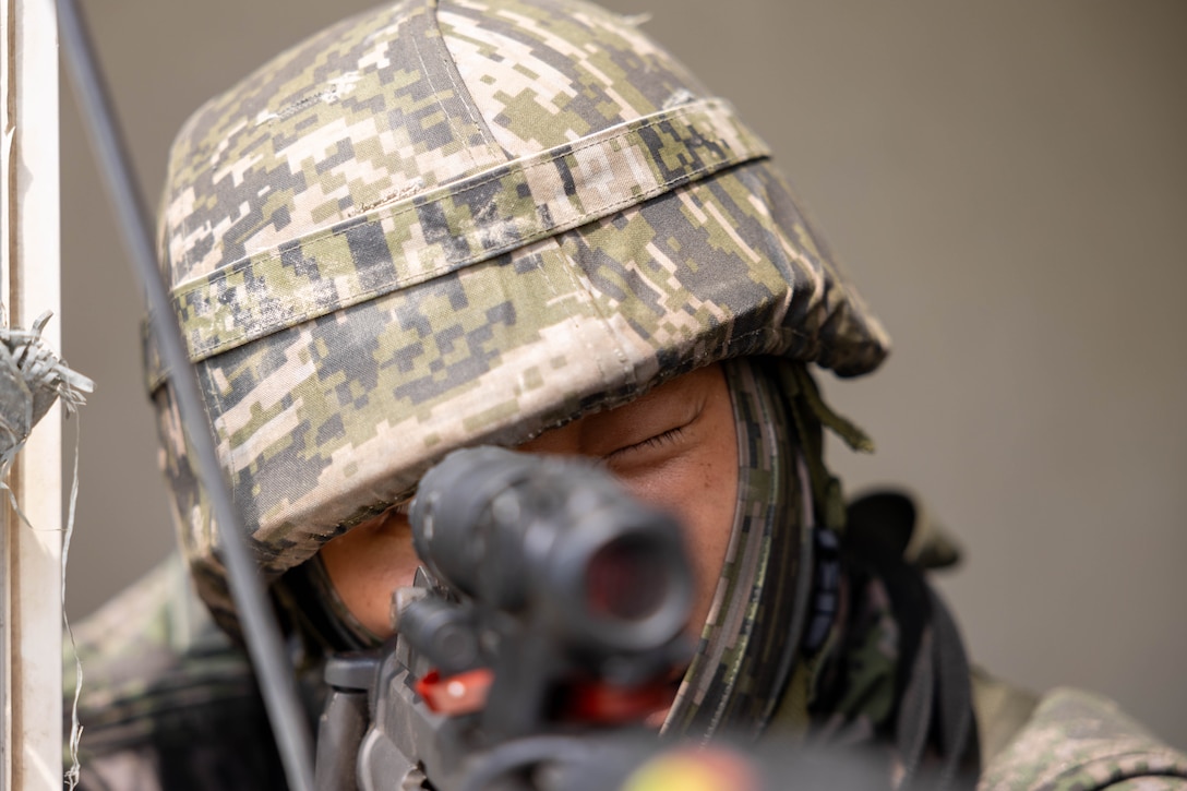 A Republic of Korea Marine with 1st Marine Division, ROK Marine Corps, maintains security during the Korean Marine Exercise Program 25.2, Pohang, South Korea, Aug. 8, 2025. KMEP is conducted regularly between the ROK and U.S. Marine Corps to increase their combined capabilities through realistic training geared towards deterrence and maintaining peace in the Indo-Pacific.  (U.S. Marine Corps photo by Cpl. Kanoa Thomas)