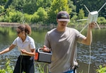 DAHLGREN, Va. – Science and Engineering Apprenticeship Program interns prepare equipment for testing an unmanned surface vessel at Hideaway Pond during their final project demonstration at Naval Surface Warfare Center Dahlgren Division (NSWCDD). (Morgan Lee Tabor/NSWCDD Photo)
