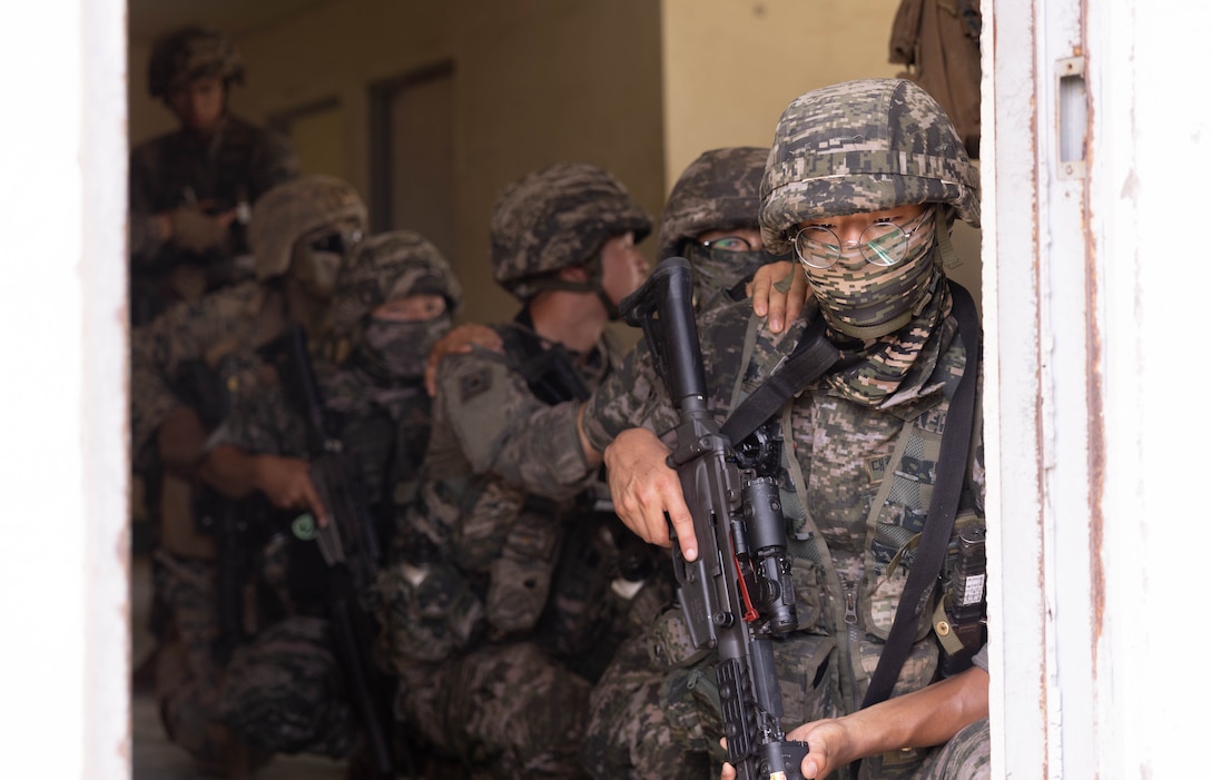 Republic of Korea Marines with 1st Marine Division, ROK Marine Corps, advance through a training area during the Korean Marine Exercise Program 25.2, Pohang, South Korea, Aug. 8, 2025. KMEP is conducted regularly between the ROK and U.S. Marine Corps to increase their combined capabilities through realistic training geared towards deterrence and maintaining peace in the Indo-Pacific.  (U.S. Marine Corps photo by Cpl. Kanoa Thomas)