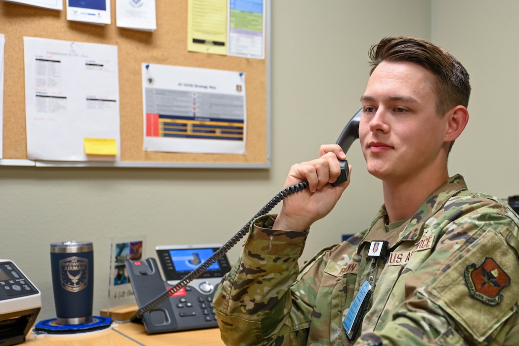 Image of an Airman on the phone.