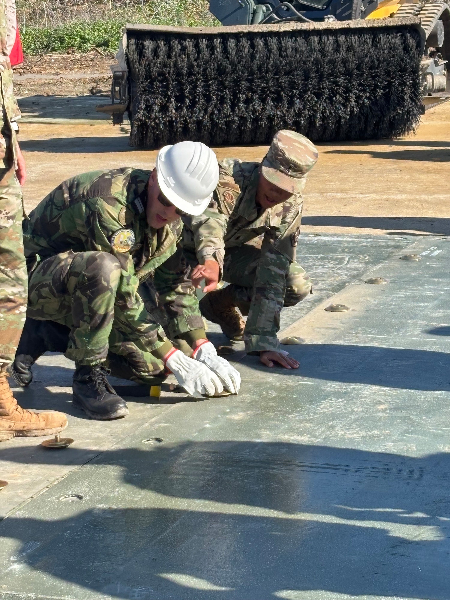 1st Lt. Aliyah Brown, Logistics Readiness Officer and Portuguese language LEAP Scholar, 735th Air Mobility Squadron, Hickam Air Force Base, interprets the application of Fiber Reinforced Polymer to Portuguese Air Force partners  while participating in a LEAP-ACE course at Morón Air Base Spain, 4 February 2025. Conveying US civil engineering techniques in the partner’s native language proved pivotal for accelerating the pace of instruction and enhancing partner interoperability.